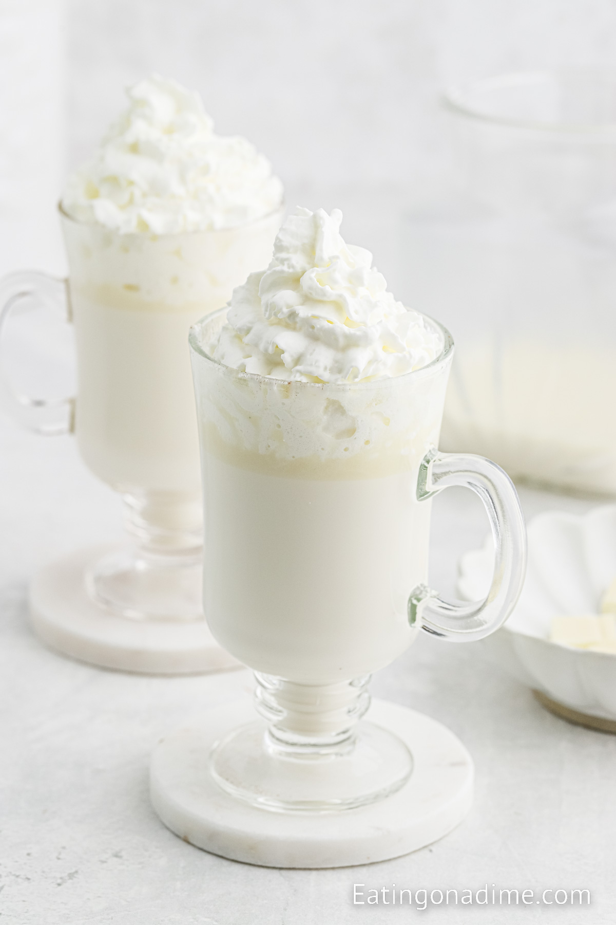 White Hot Chocolate in clear mugs topped with whipped cream