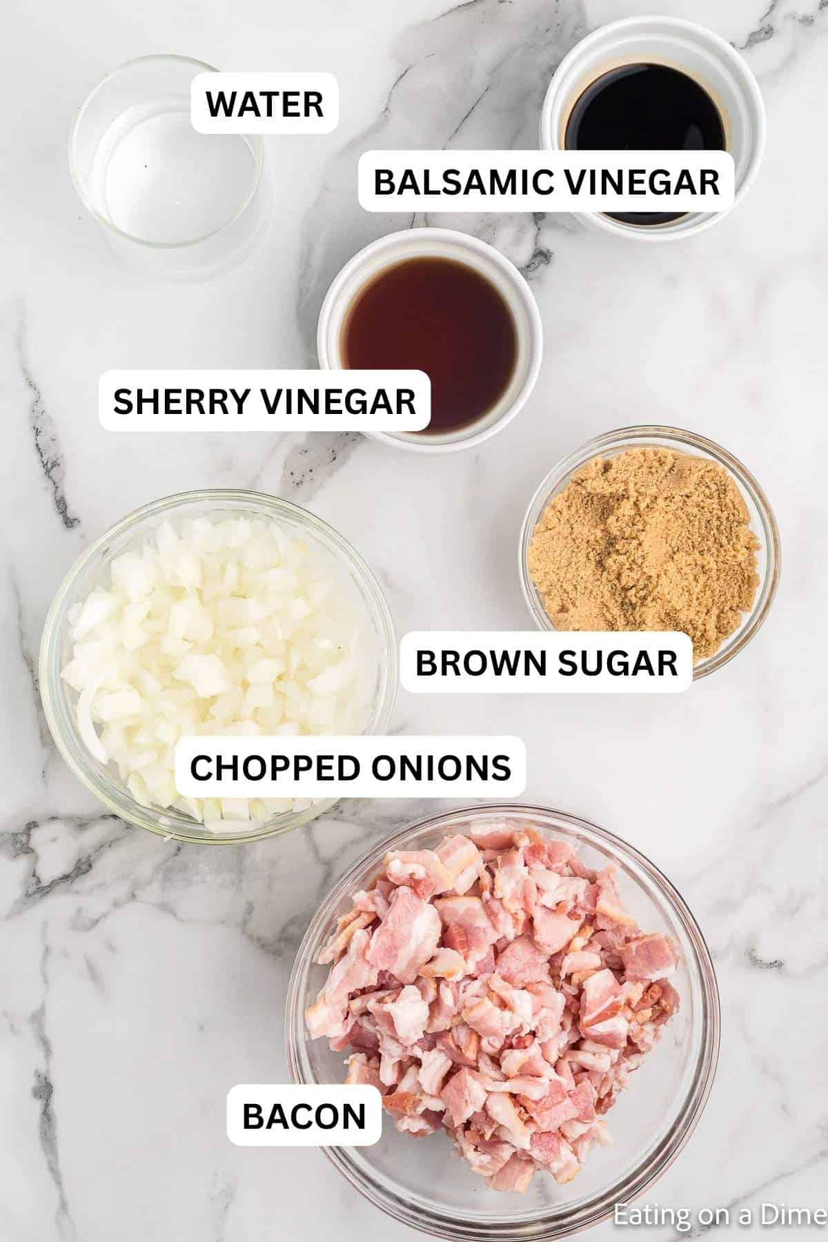 The ingredients required to make the recipe, including bacon, sweet onions, brown sugar and more.