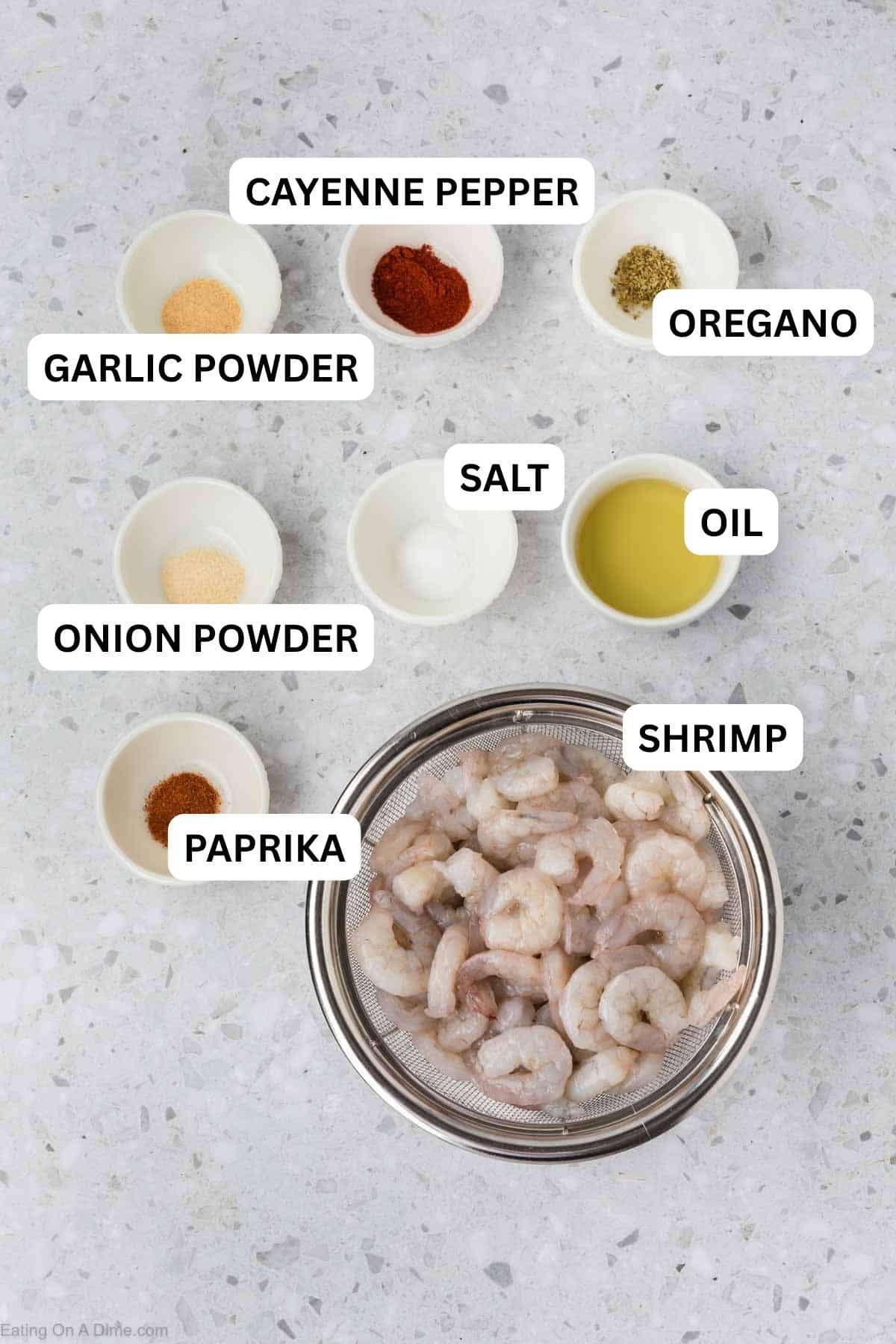 Ingredients needed for this recipe which includes Raw Shrimp, avocado oil, onion powder, garlic powder, cayenne pepper, oregano, salt, and paprika.
