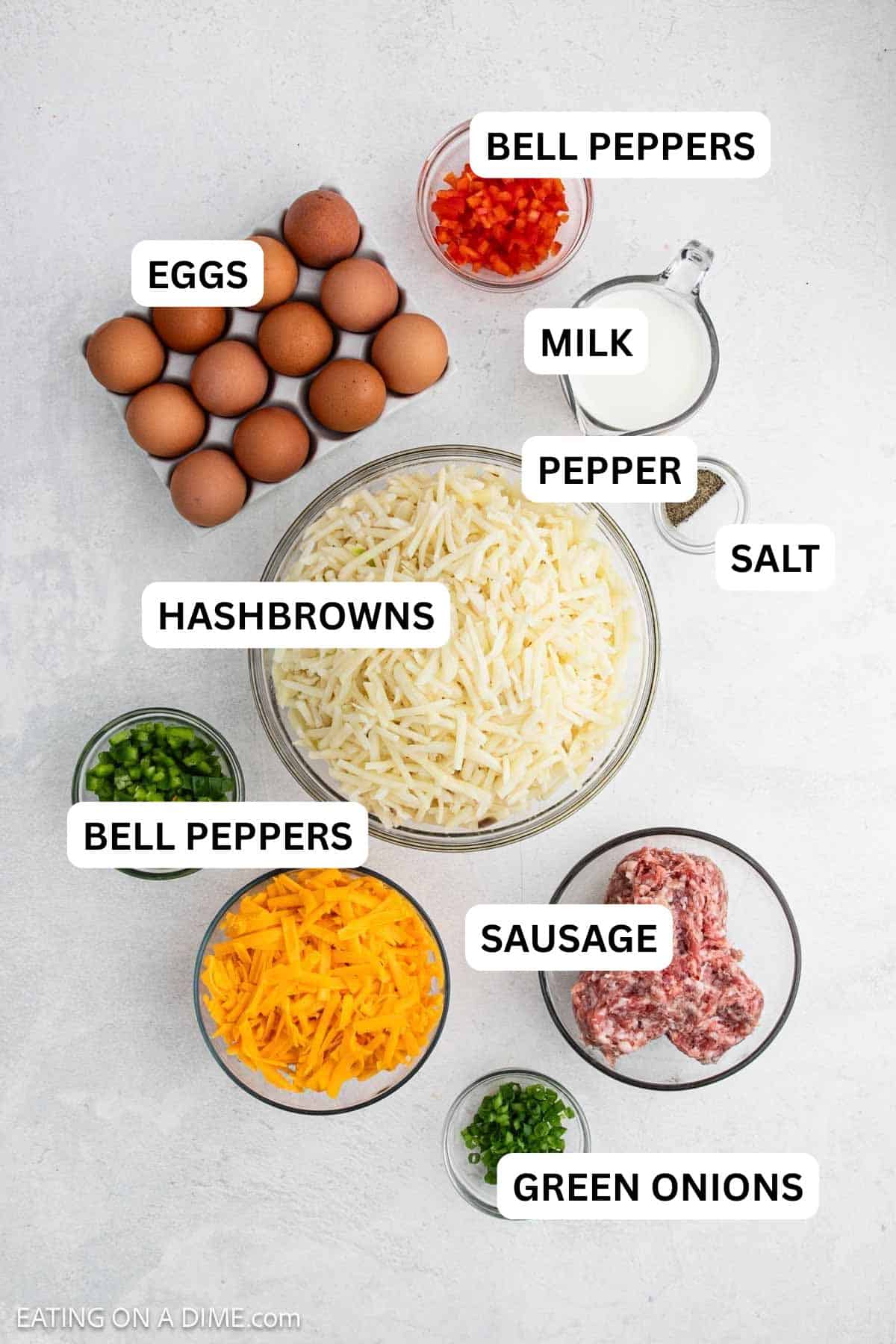 Ingredients needed for this recipe includes hashbrowns, sausage, eggs, milk, cheese, onion, bell pepper, salt and pepper.