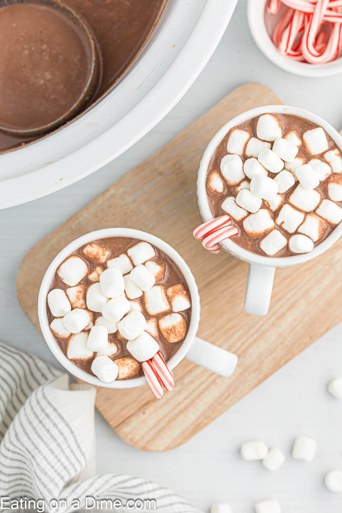 Hot Chocolate mugs topped with marshmallows and candy canes