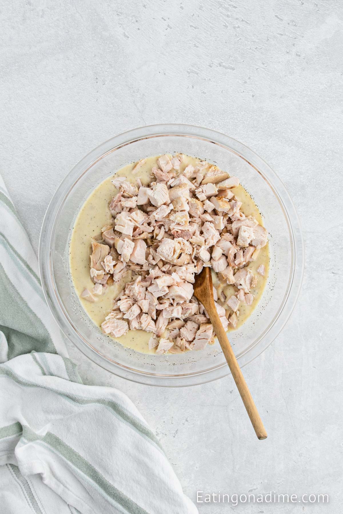 Adding in the diced cooked chicken into the cream sauce