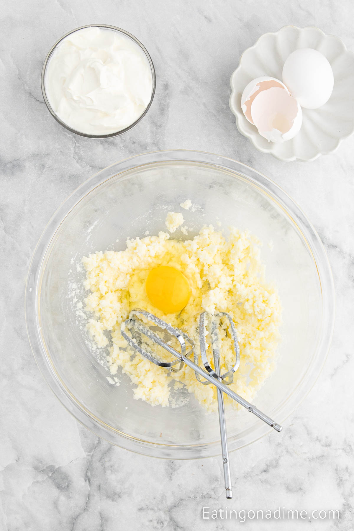 Mixing sugars with butter and eggs