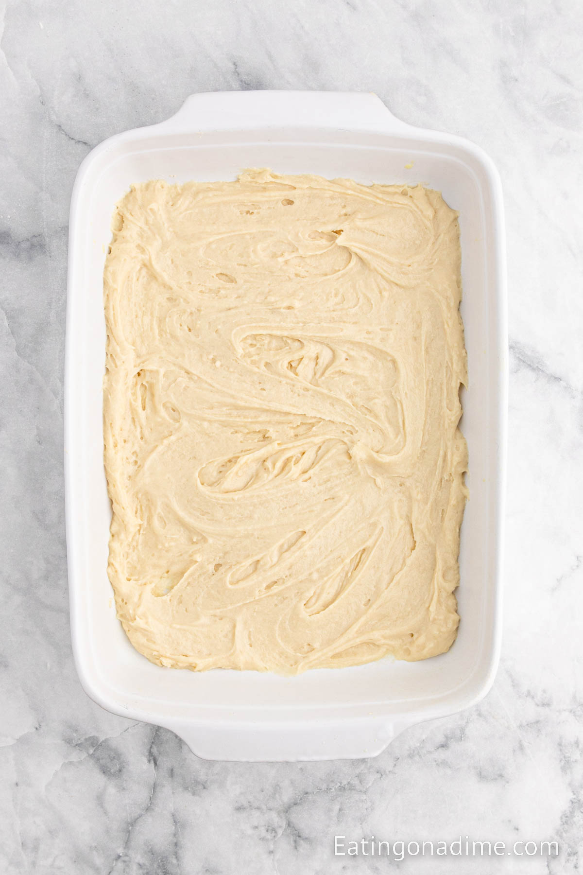 Spread the cake batter into baking dish