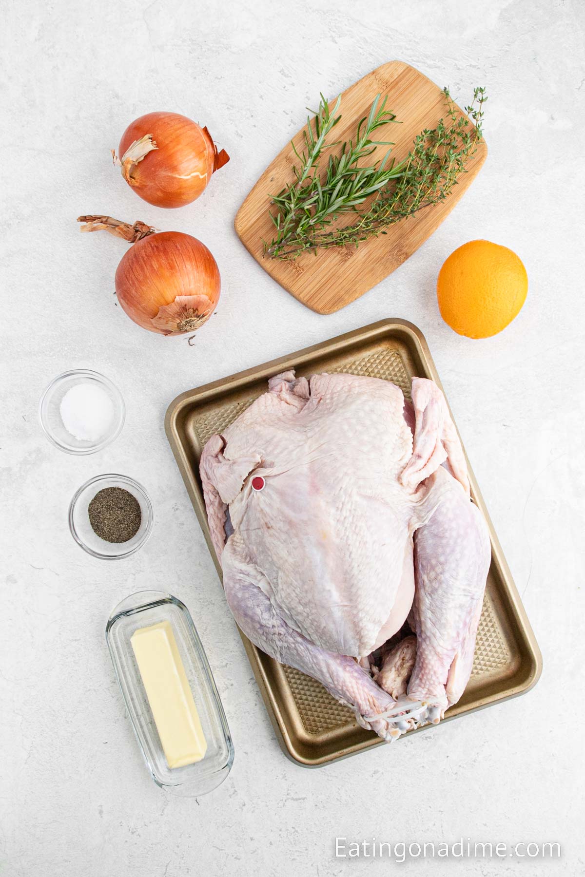 Ingredients for Christmas Turkey - Whole Turkey, large onion, large orange, rosemary sprigs, thyme sprigs, butter, salt and pepper