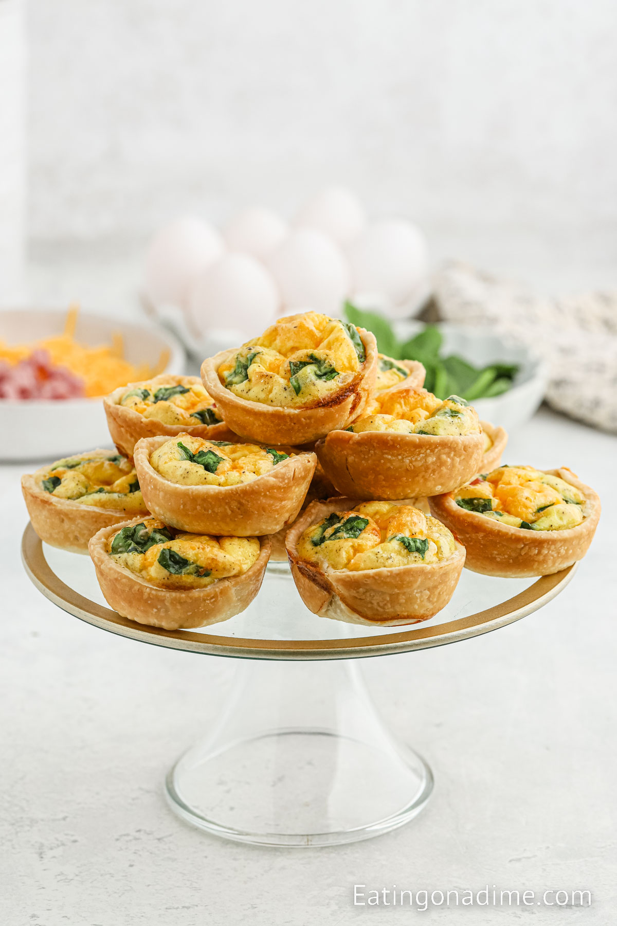 Quiche Muffins stacked on a cake stand