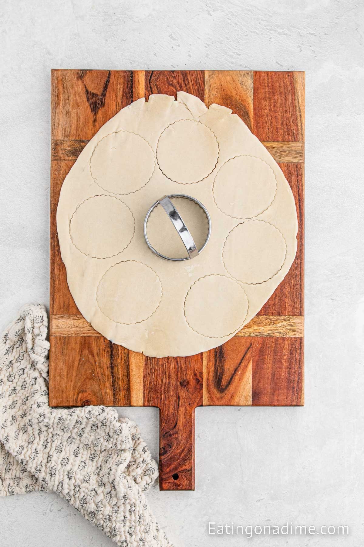 Cutting the dough into round circles on the cutting board