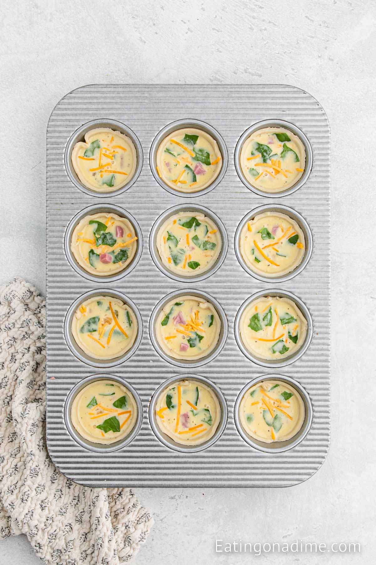Pouring the egg mixture into the muffin tin