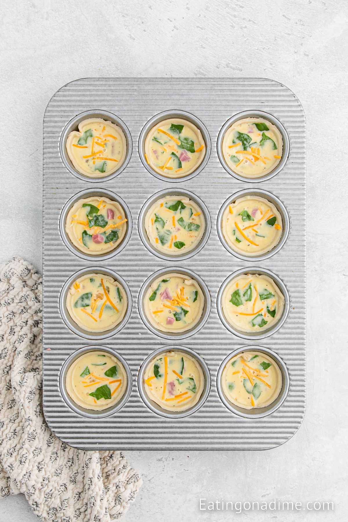 Pouring the egg mixture into the muffin tin