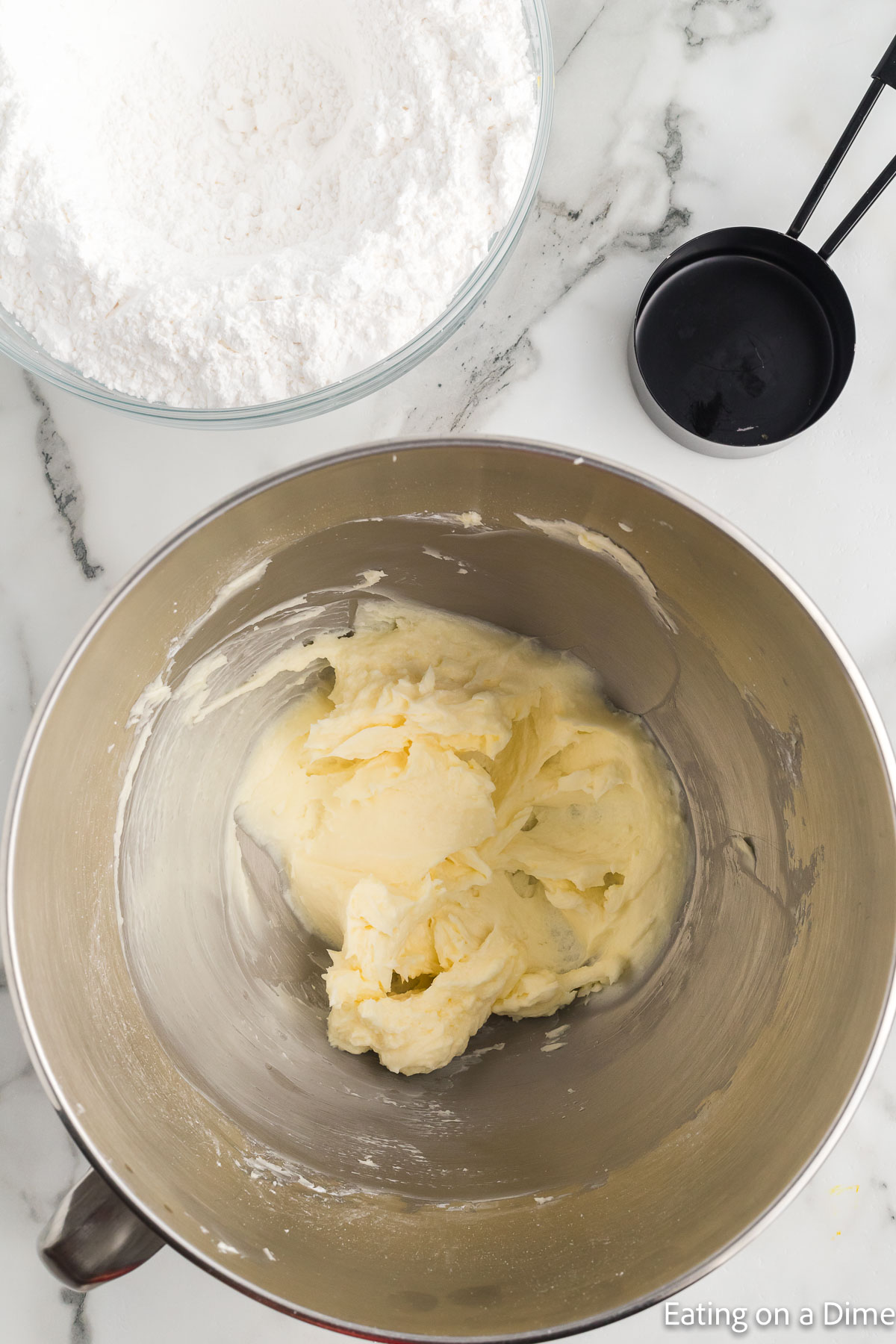 Adding the powdered sugar to the butter mixture