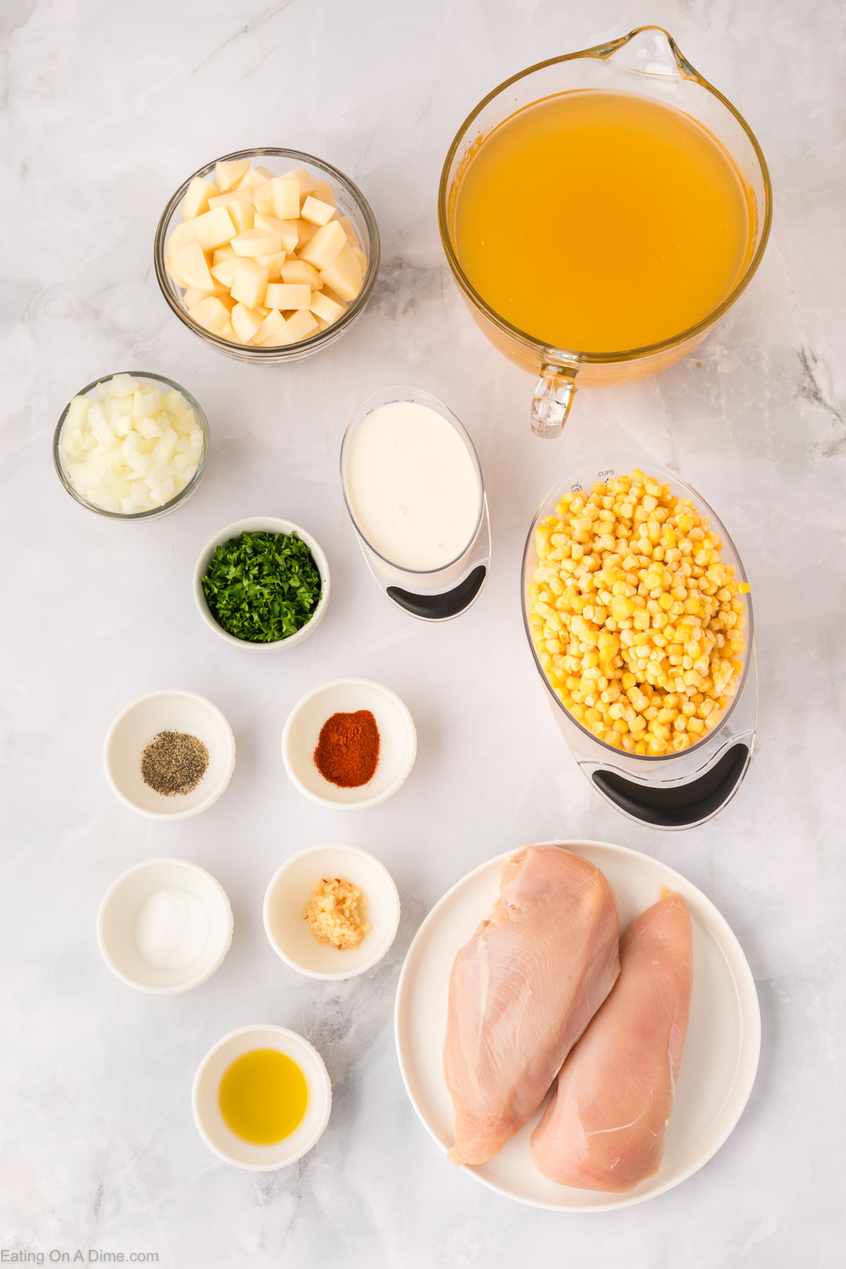 Chicken Corn Soup ingredients - chicken breast, oil, onion, garlic, chicken broth, corn, potatoes, paprika, salt, pepper, heavy cream, parsley