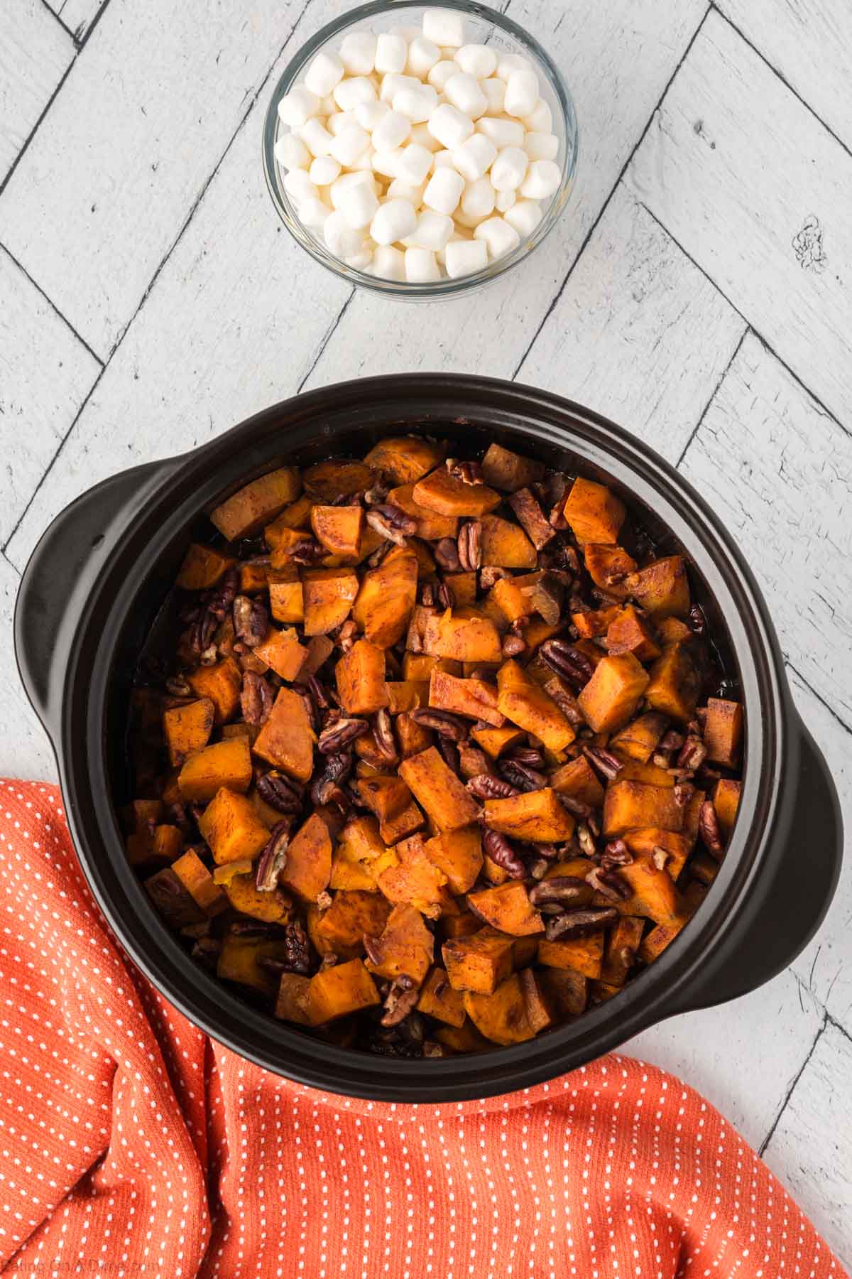The sweet potatoes and pecans cooked in a cock pot.  