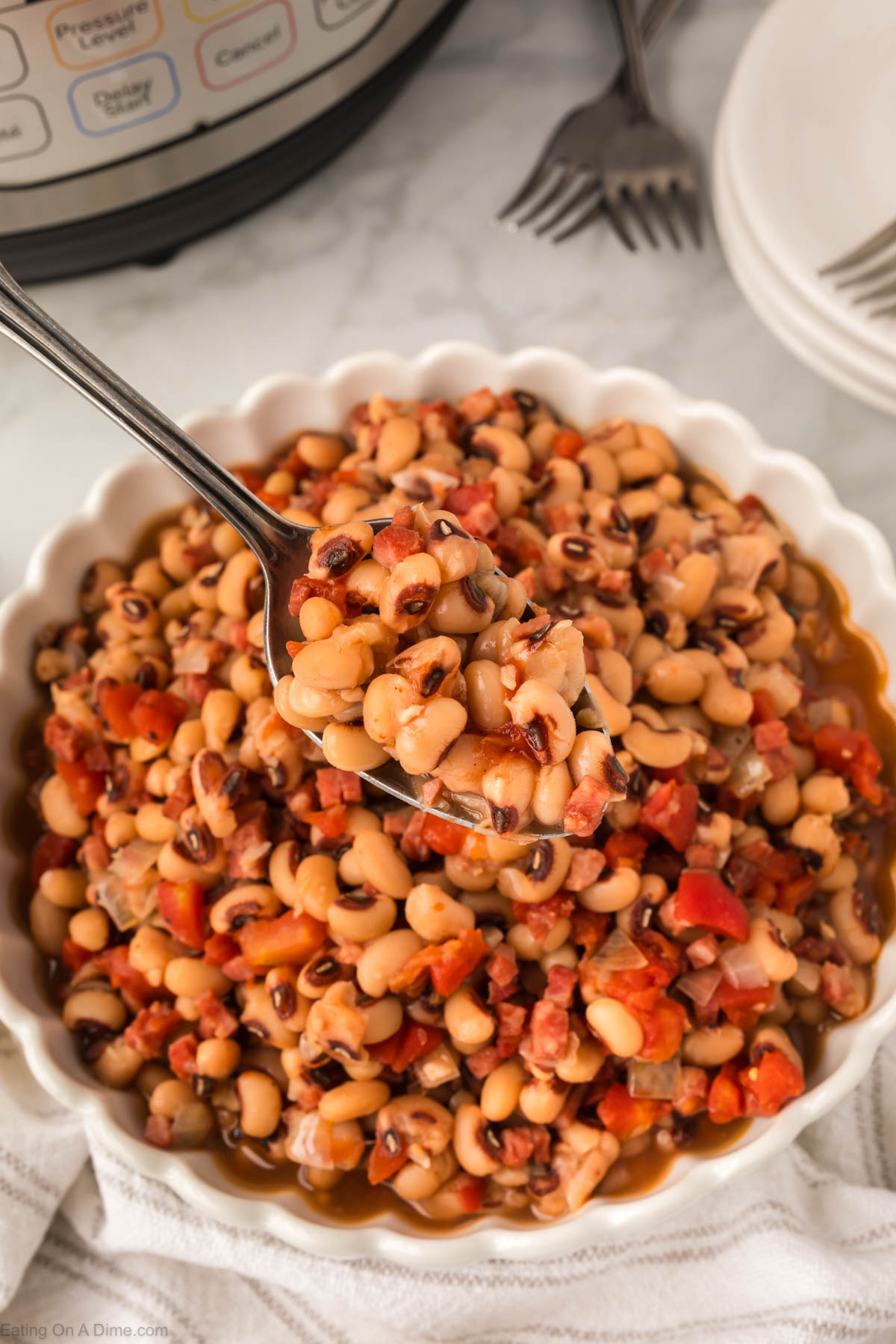 Black eyed peas in bowl with a serving on a spoon