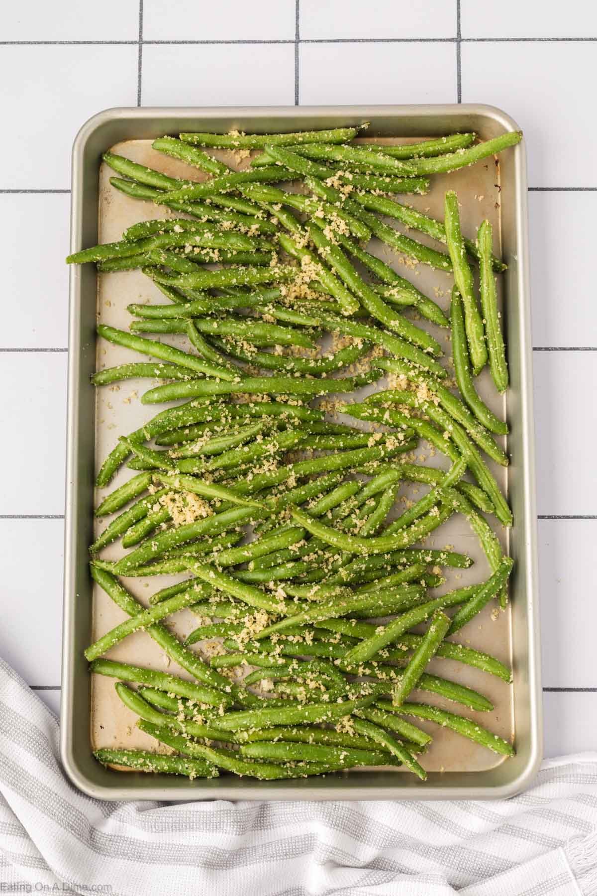 Spread the green beans on the baking sheet