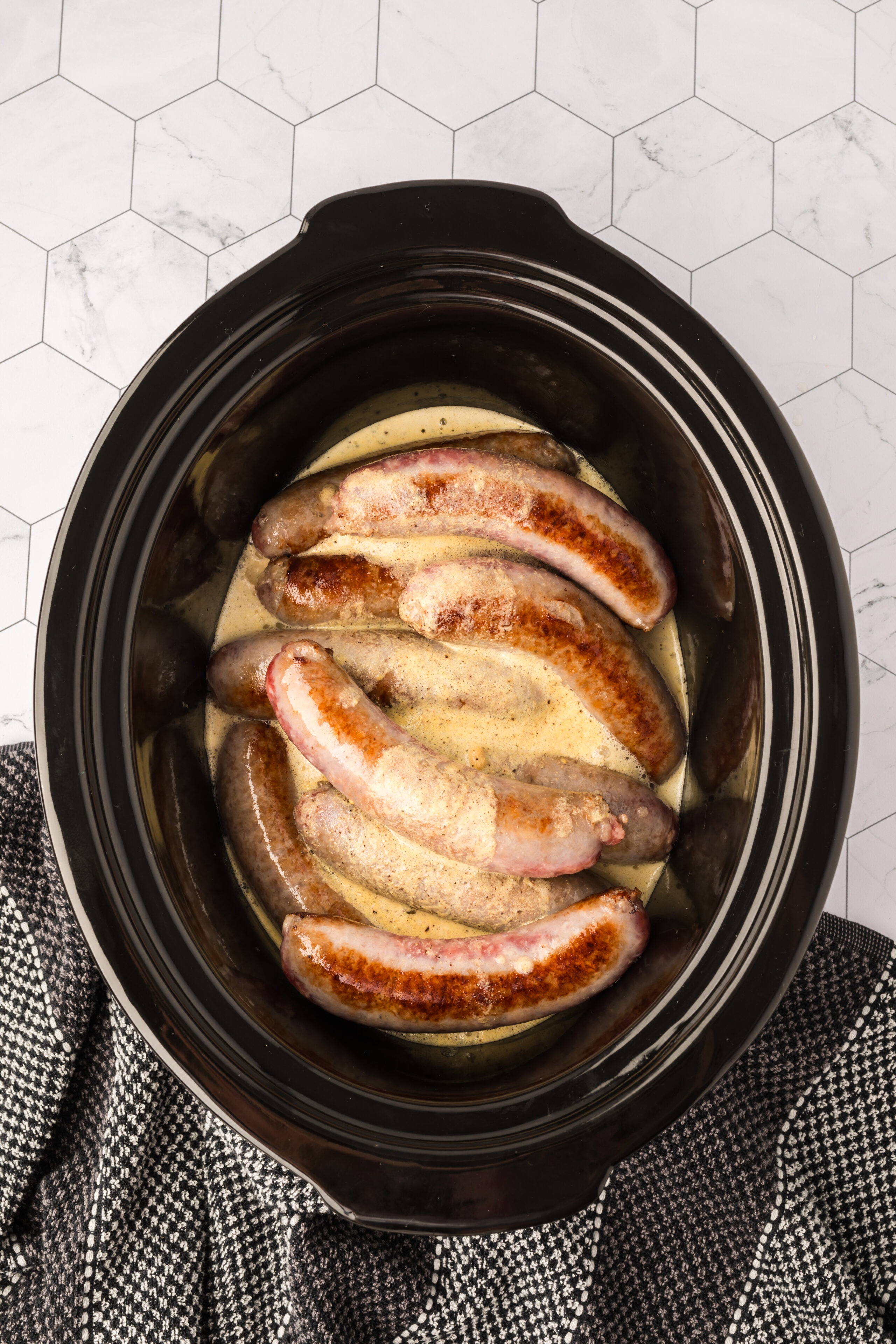 Cooking the brats in the slow cooker
