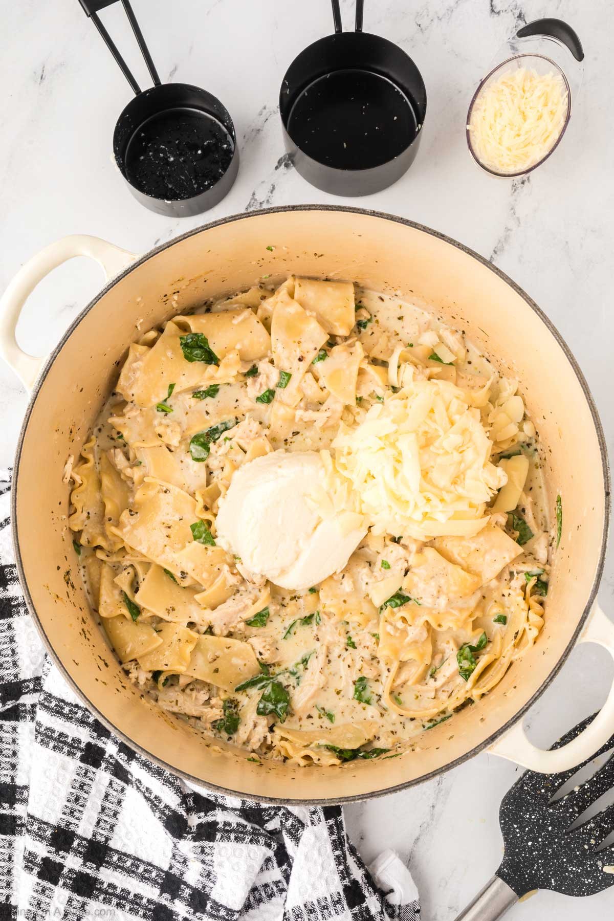 Adding in the ricotta and mozzarella cheese to the soup