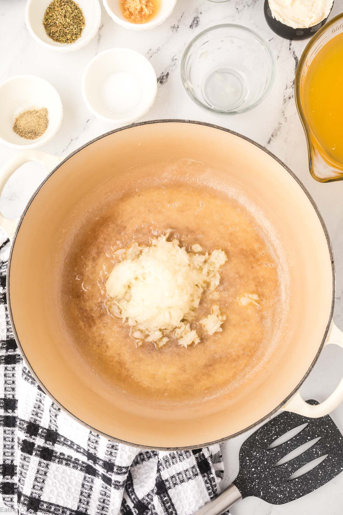 Cooking the onions in the butter in a large pot