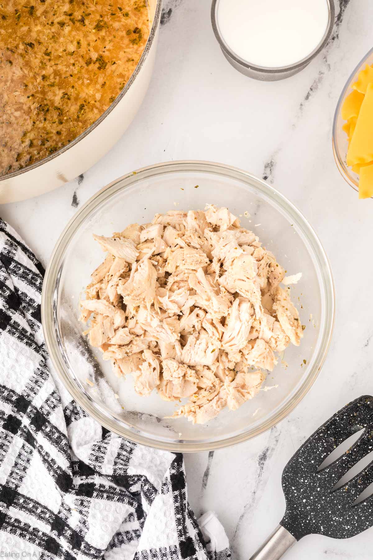 Shredding the chicken in a bowl