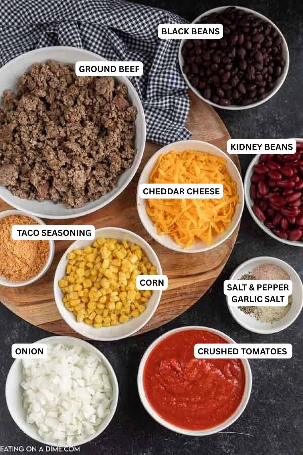 Crockpot Taco Soup Recipe is one of my go to meals on busy weeks because it is so easy. The flavor is just amazing and the entire family goes crazy over it. Ingredients for recipe: crushed tomatoes, onion, salt, pepper, garlic salt, corn, taco seasoning, cheese, kidney beans, black beans and ground beef.