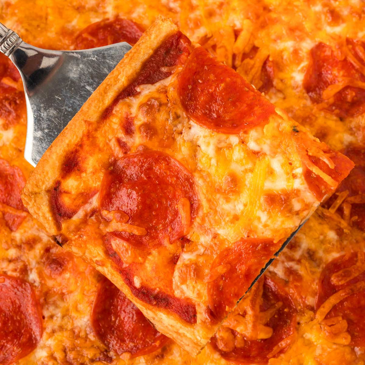 https://www.eatingonadime.com/wp-content/uploads/2023/10/crescent-roll-pizza-square.jpg