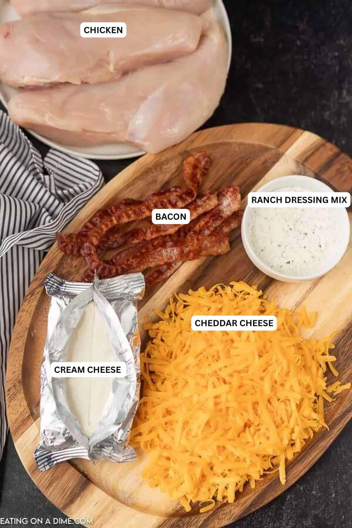 Ingredients for recipe: chicken, bacon, ranch dressing mix, cream cheese and cheddar cheese.