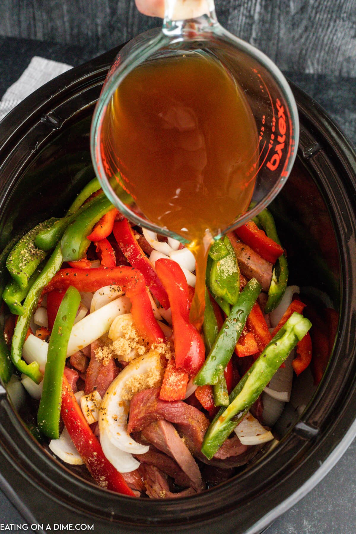 The beef broth poured over the ingredients int he crock pot.  