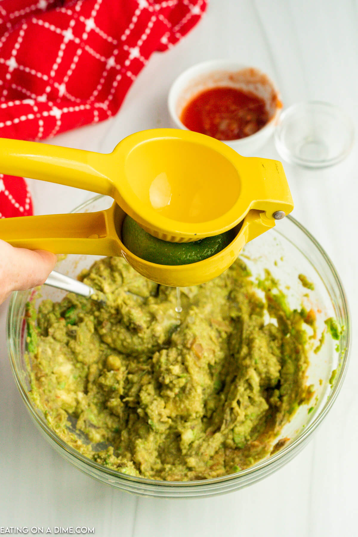 Squeezing fresh lime into the guacamole