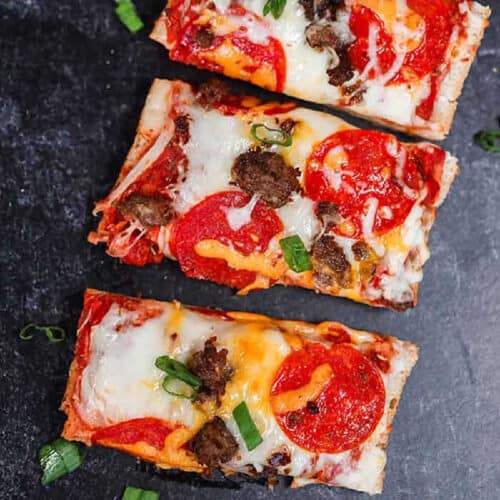 French bread pizza topped with pepperoni, veggies and melted cheese.
