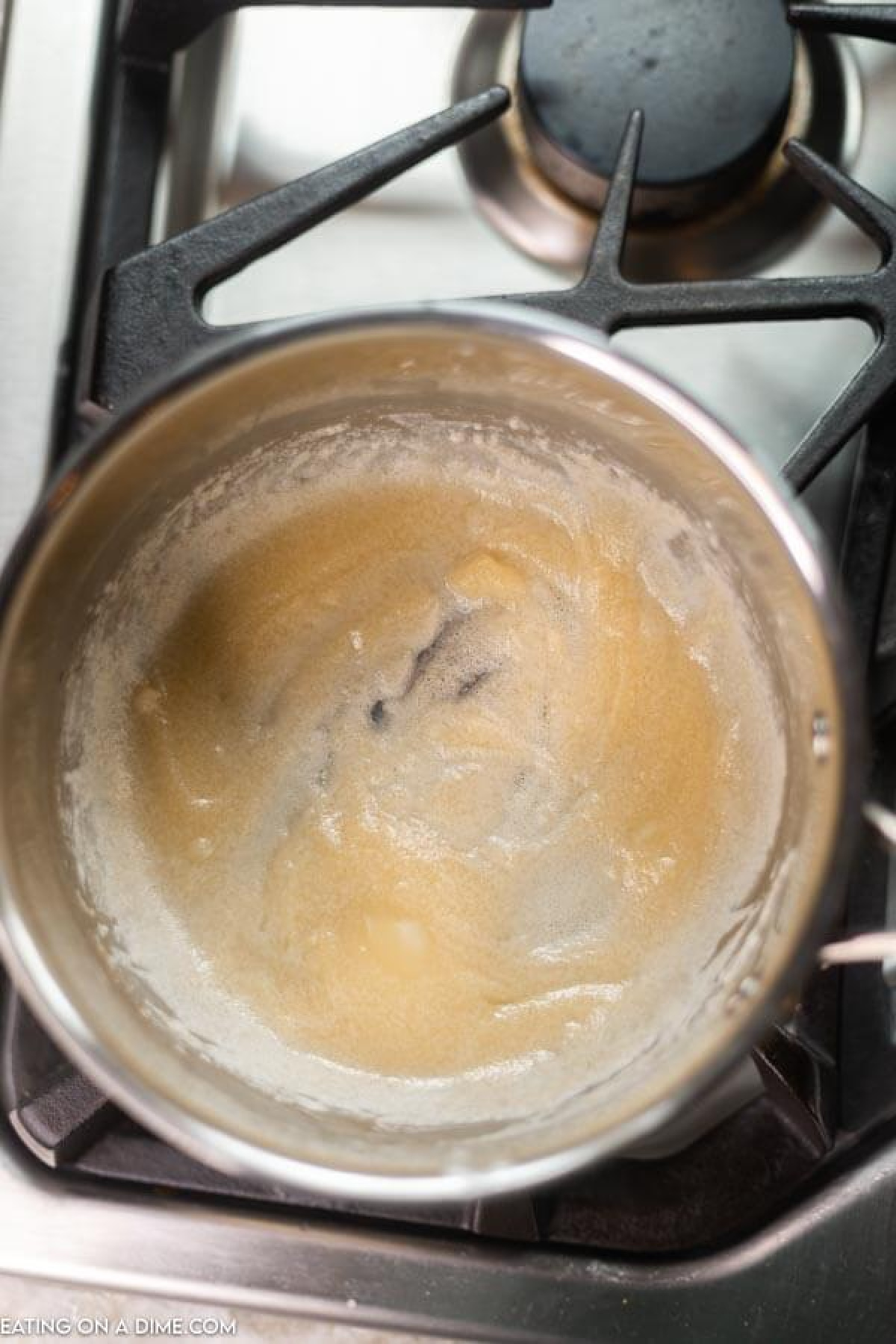 Making the gravy roux in a sauce pan with butter and flour