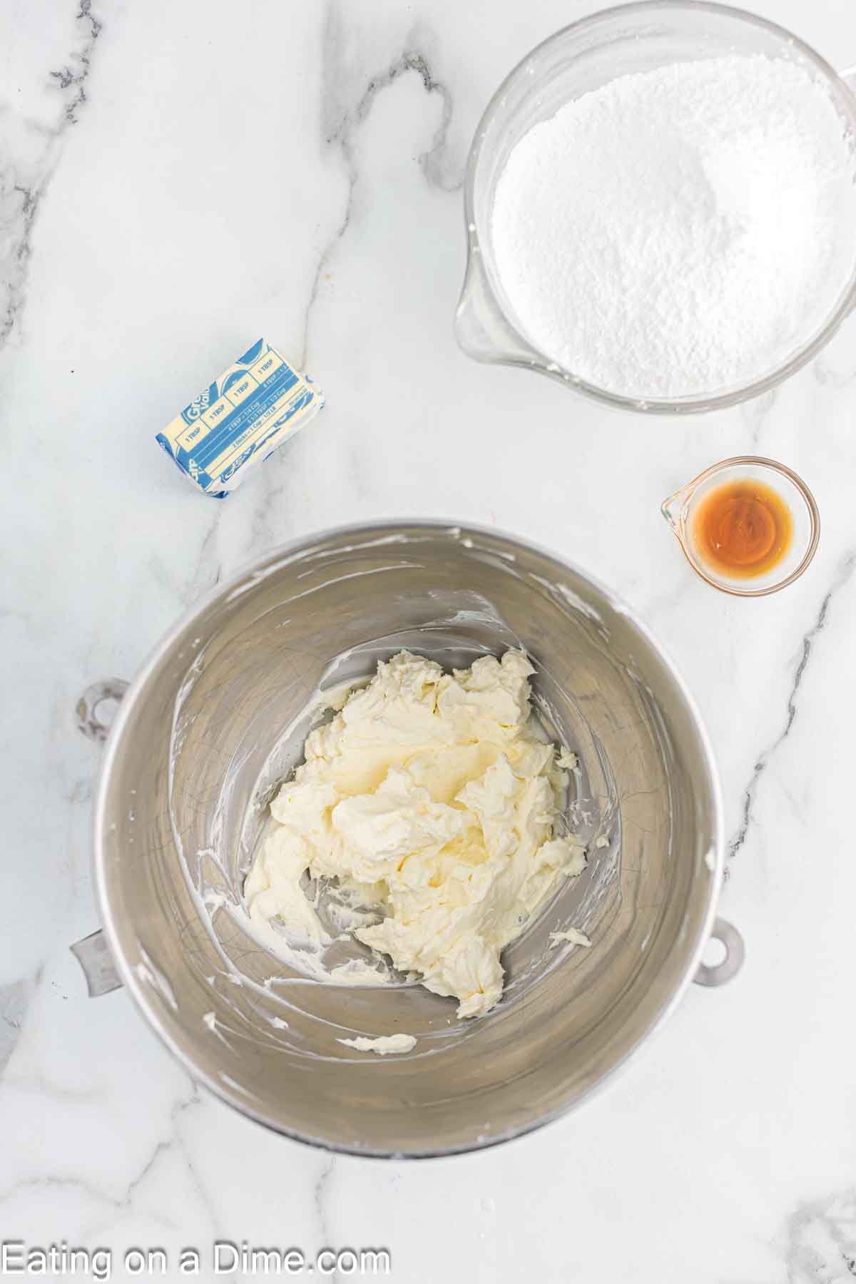 Beating the cream cheese in a bowl