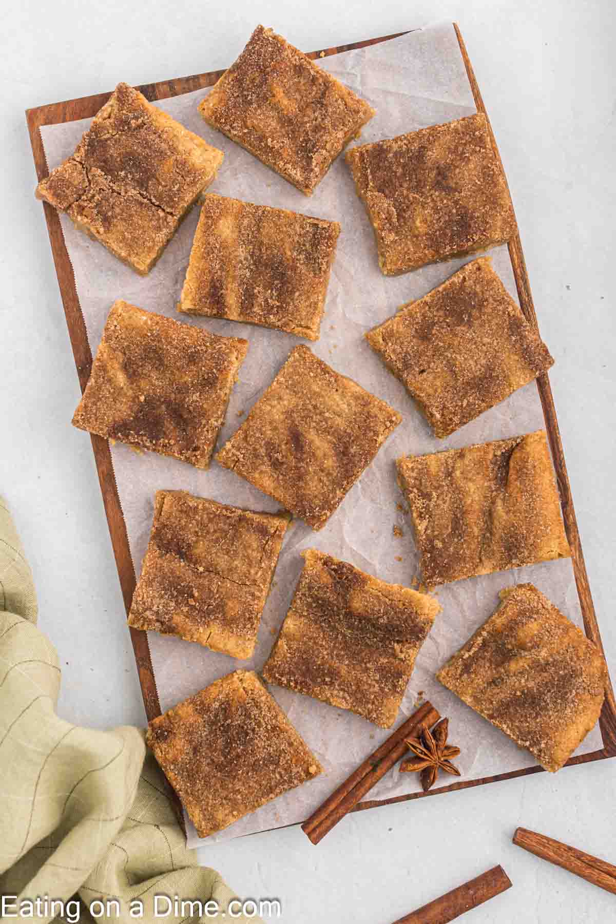 Snickerdoodle blondies cut into squares and placed on a platter