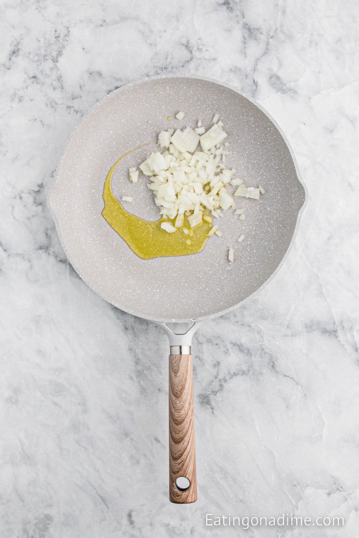 Cooked chopped onions in a skillet with oil