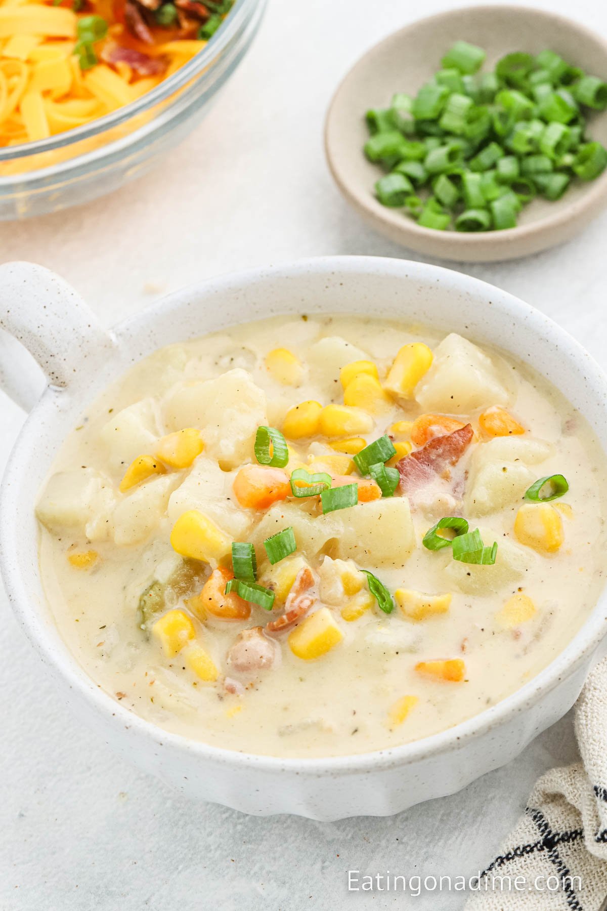 A white bowl of potato corn chowder