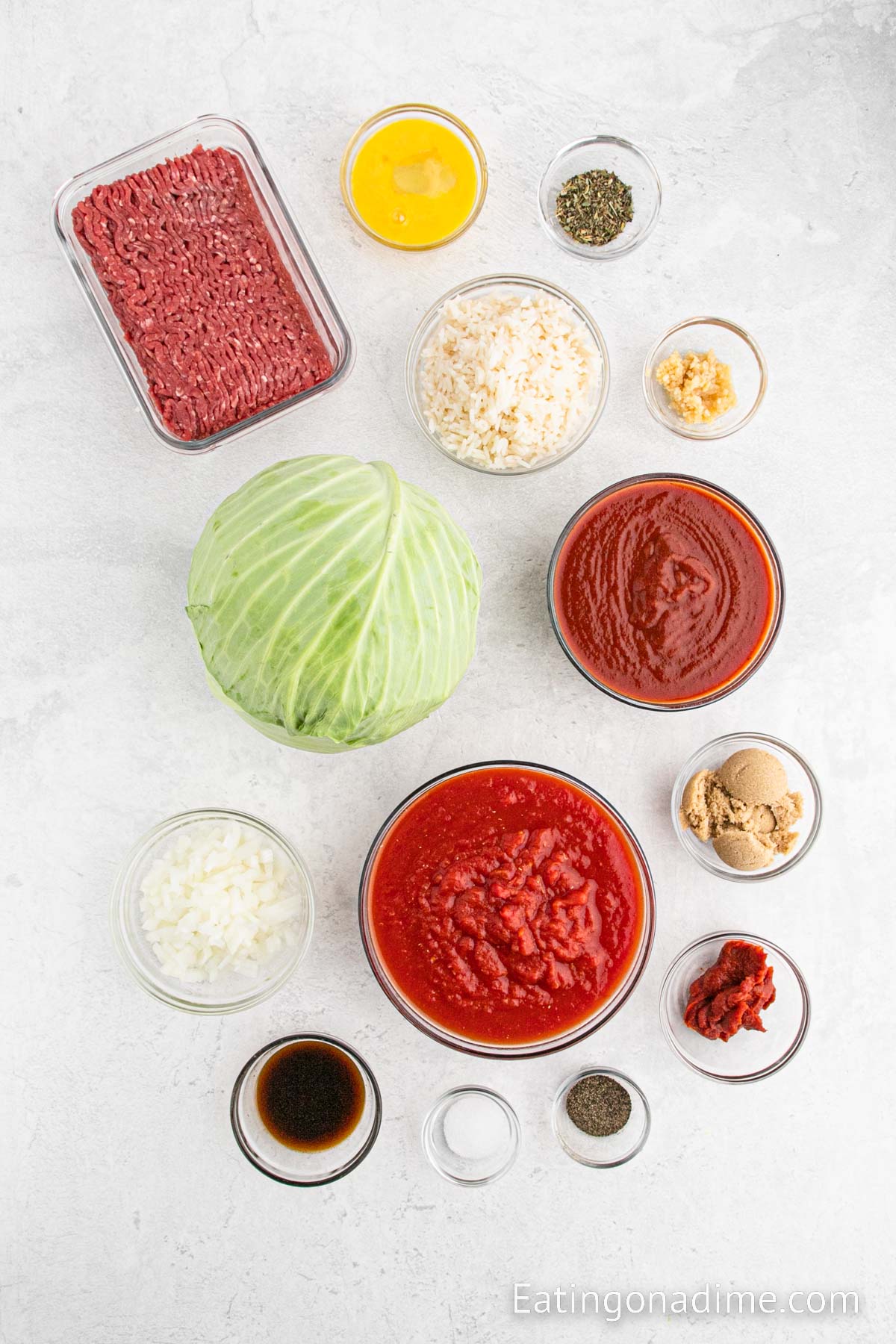 Cabbage Rolls Ingredients - cabbage, ground beef, onion, rice, minced garlic, egg, italian seasoning, salt, pepper, crushed tomatoes, tomato sauce, tomato paste, worcestershire sauce, brown sugar