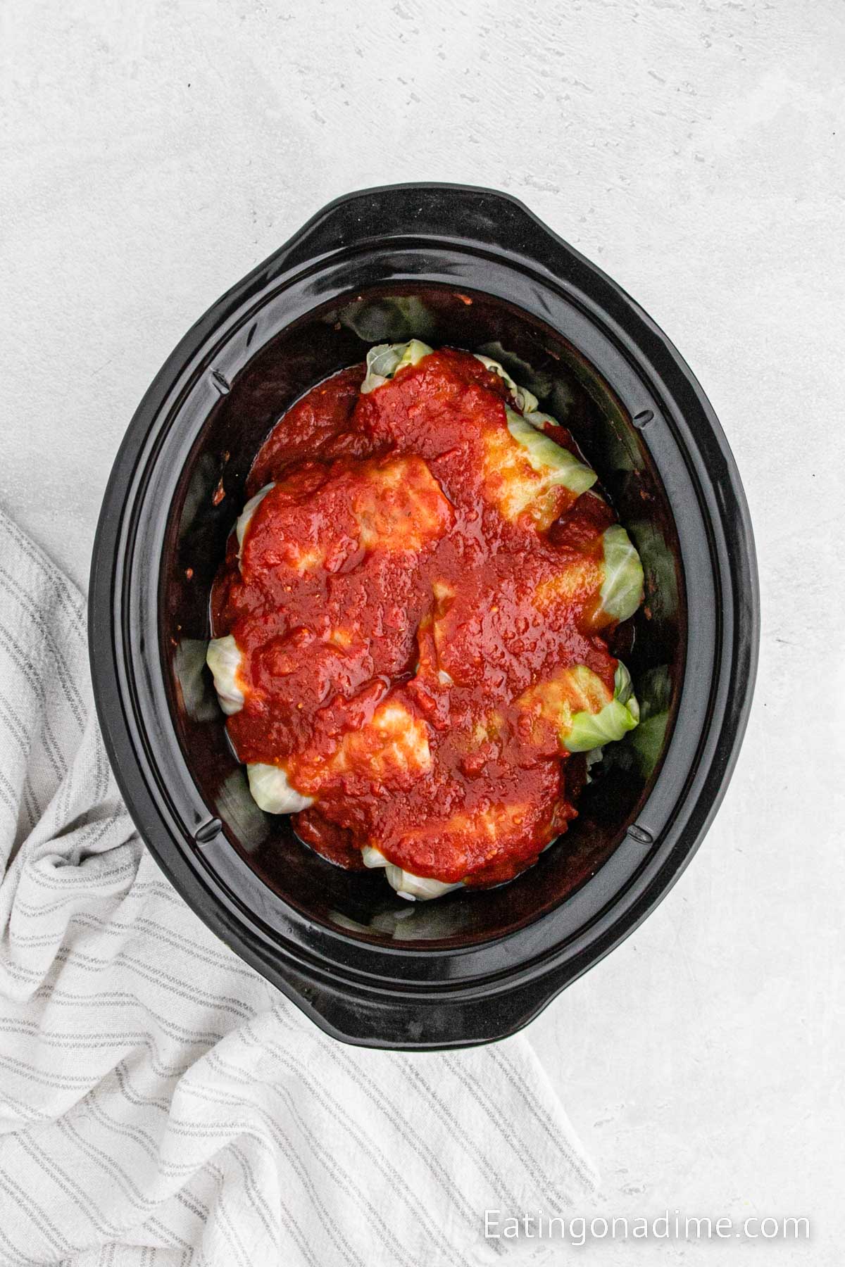 Layering the cabbage rolls in a slow cooker