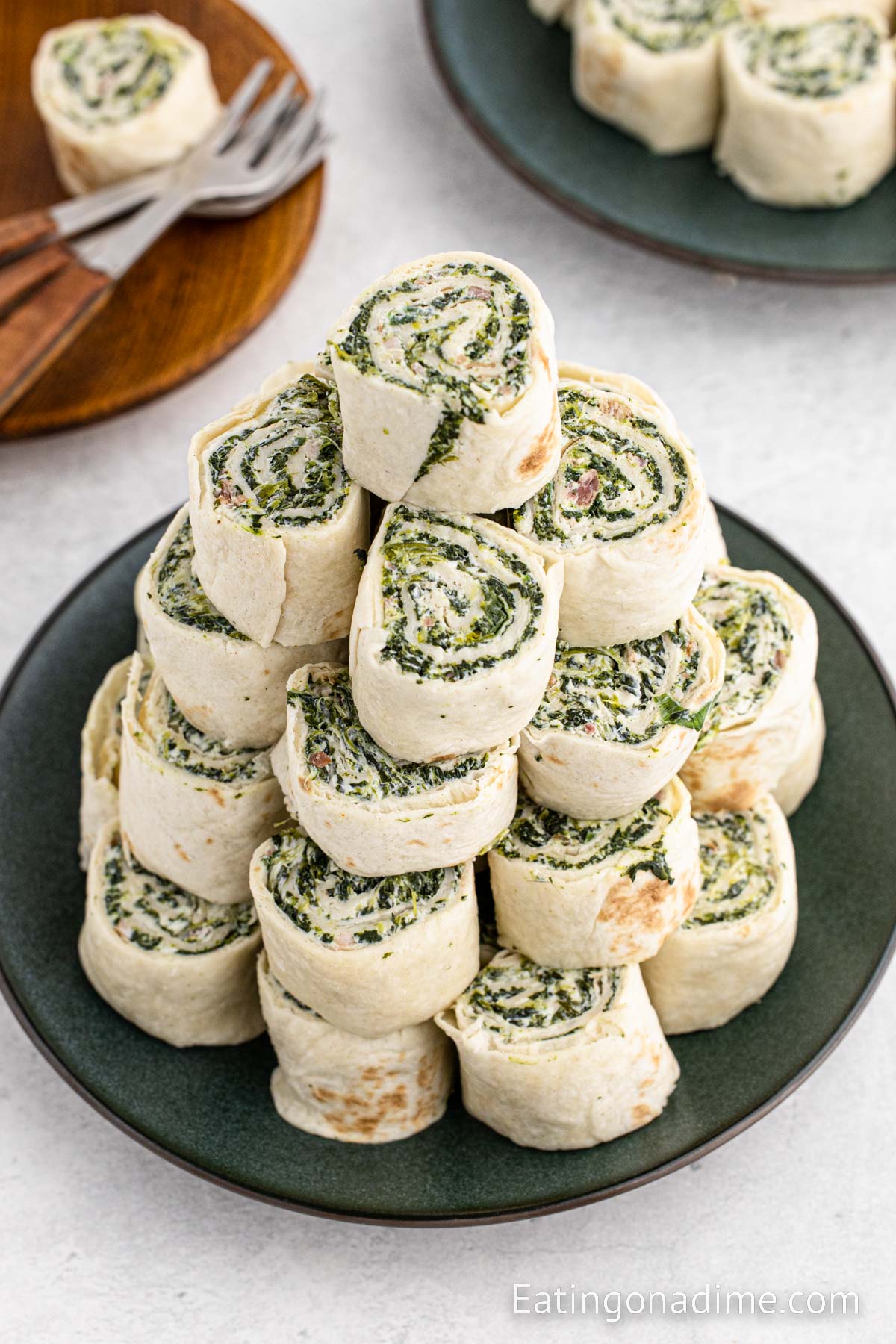 Spinach Rolls Ups stacked on a plate