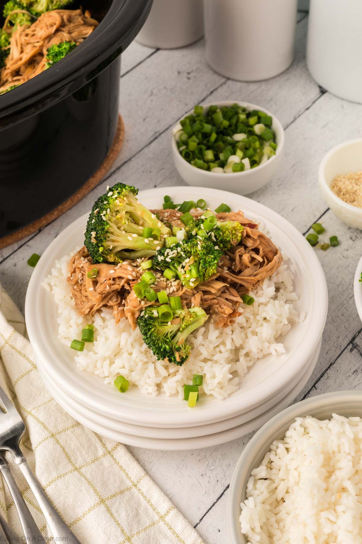 chicken and broccoli over rice on a plate