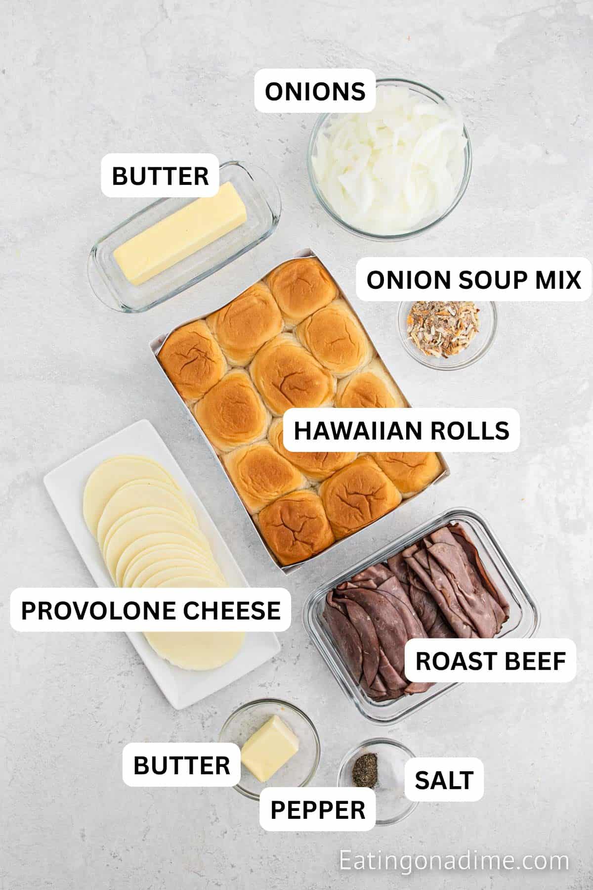 Ingredients for recipe: butter, salt, pepper, hawaiian rolls, roast beef, provolone cheese, onion soup mix, au jus gravy mix, fresh parsley.