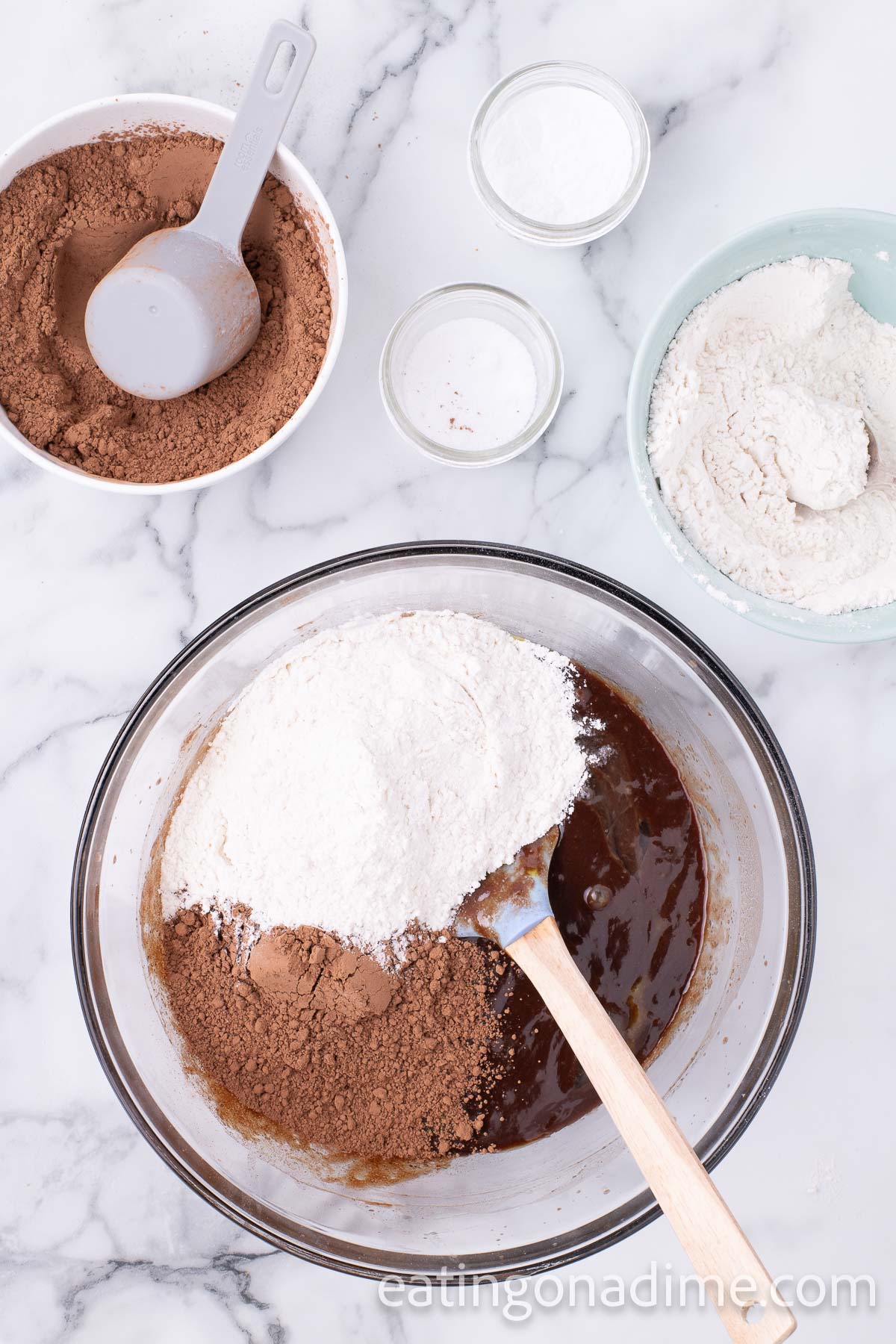 Cocoa powder, flour, salt, and baking powder mixed in with sugar mixture