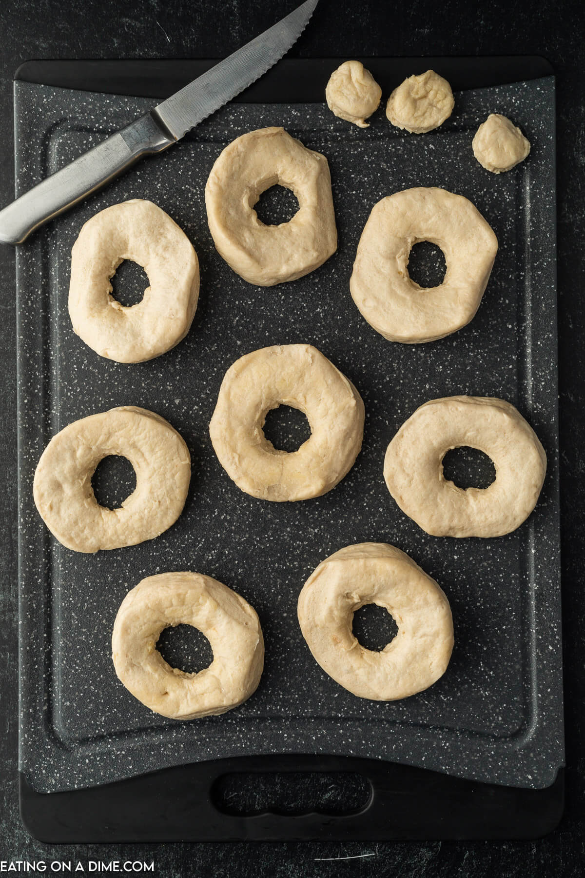 Biscuit donuts on a cutting sheets