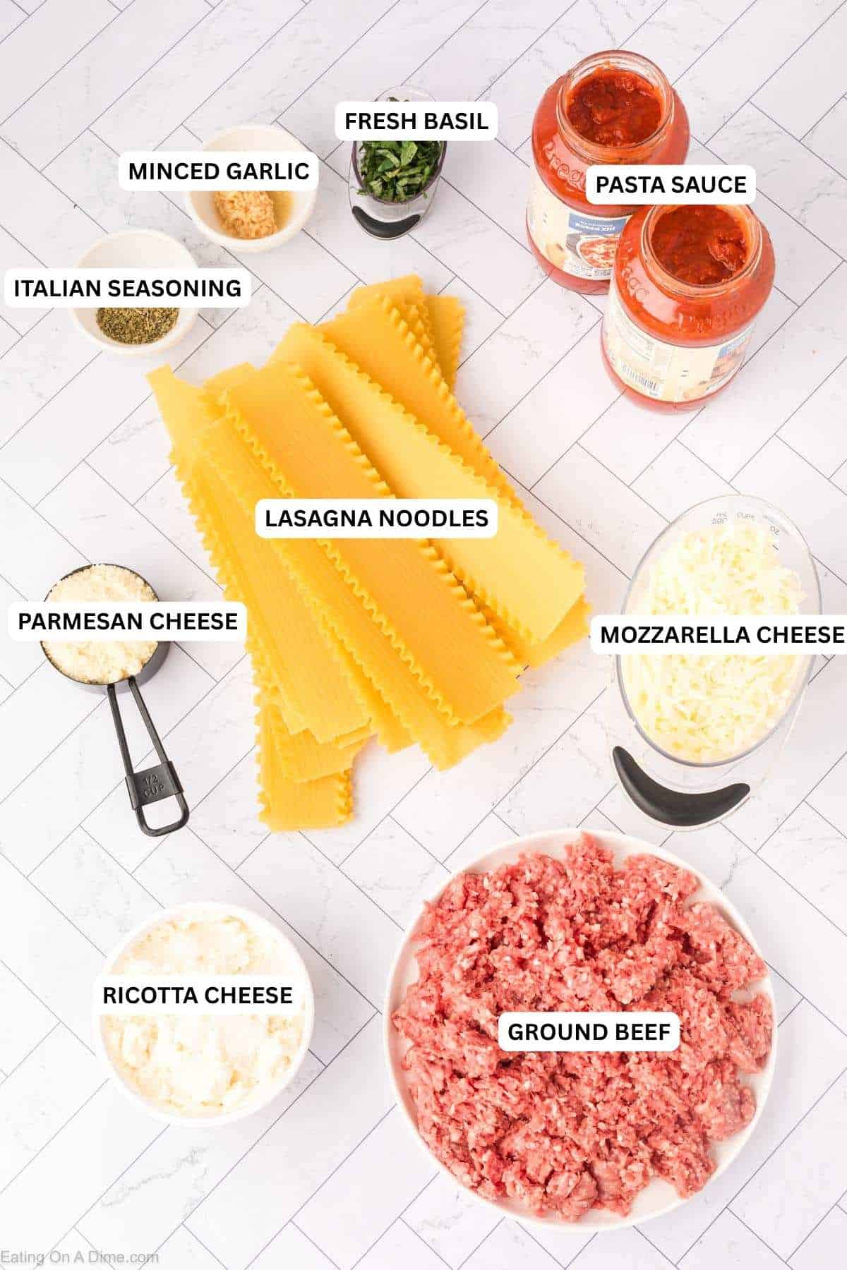 Ingredients for recipe: ground beef, ricotta cheese, mozzarella cheese, parmesan cheese, lasagna noodles, pasta sauce, Italian seasoning, minced garlic and basil.
