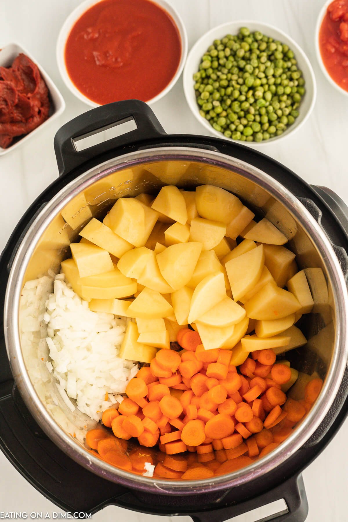 Adding the vegetables to the instant pot