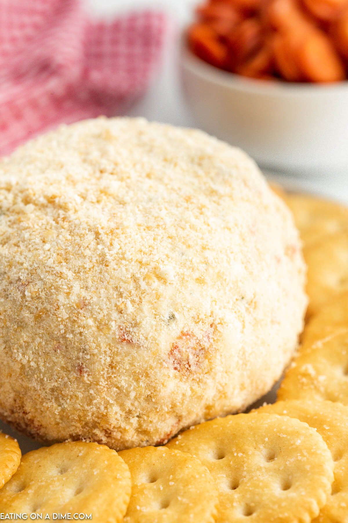 Pepperoni Cheese Ball on a platter with crackers