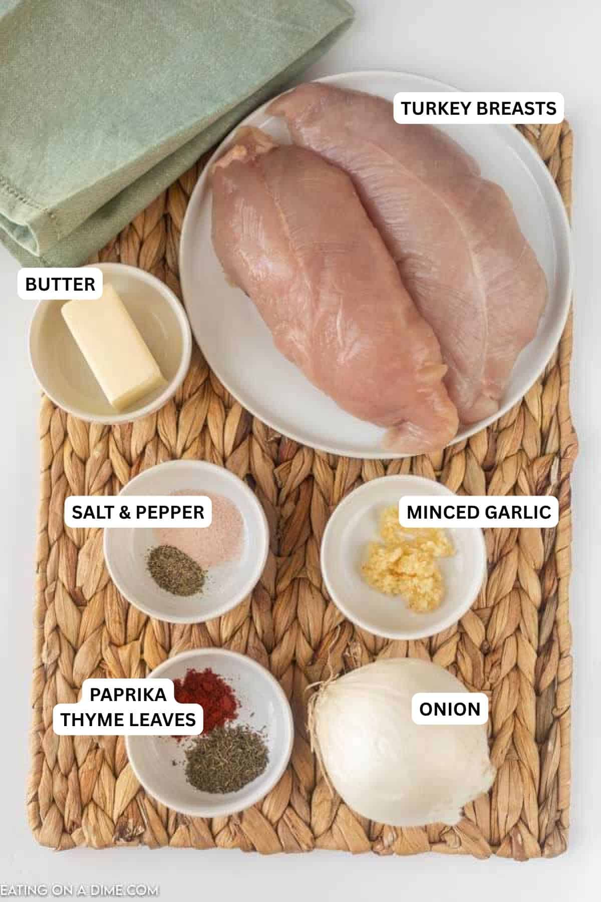 Ingredients for recipe: onion, paprika, thyme leaves, minced garlic, salt, pepper, butter and turkey breasts.