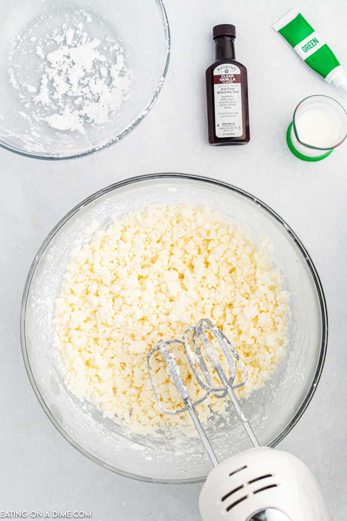 Powdered sugar added to bowl. 