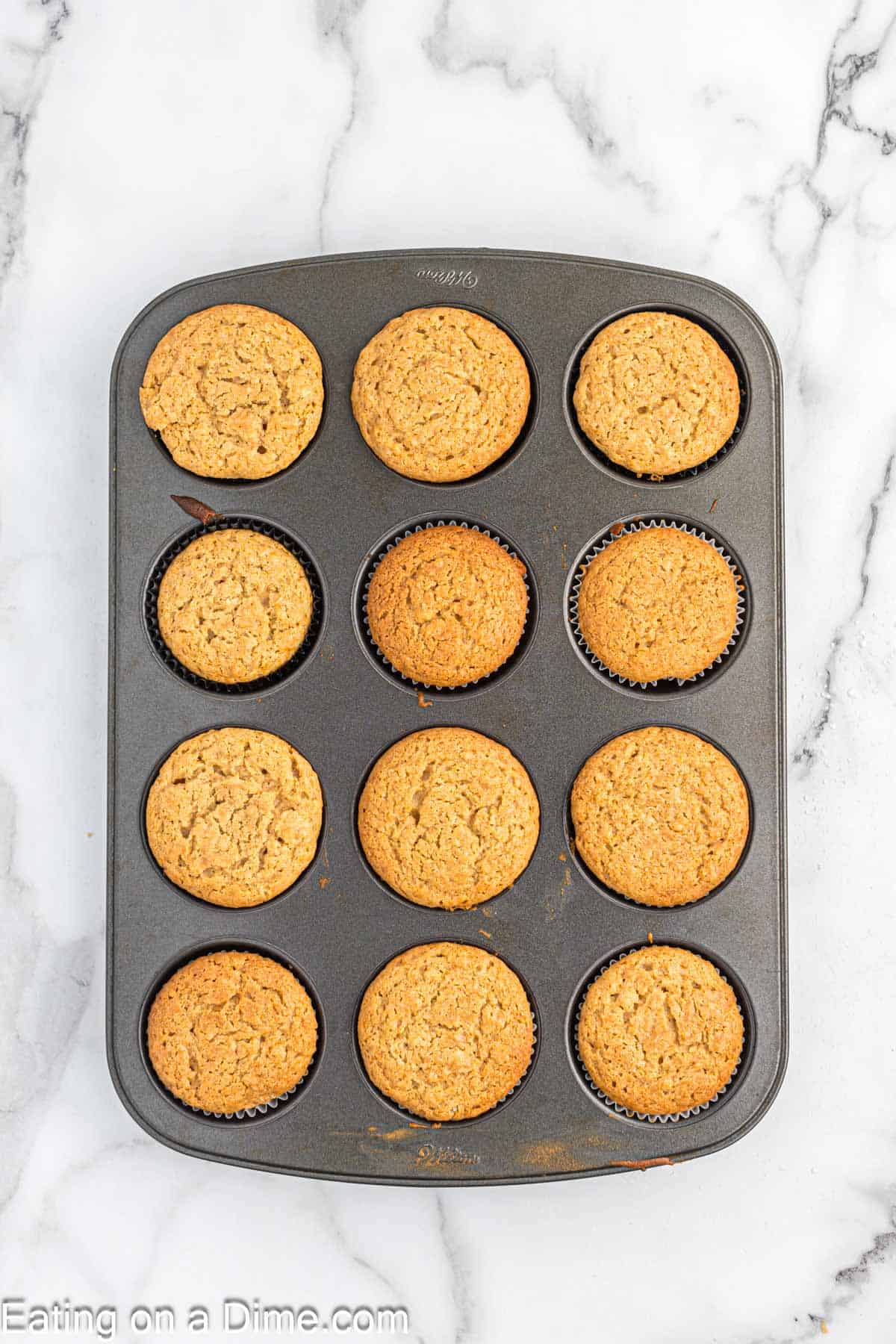 Baked peanut butter cupcakes in a muffin tin