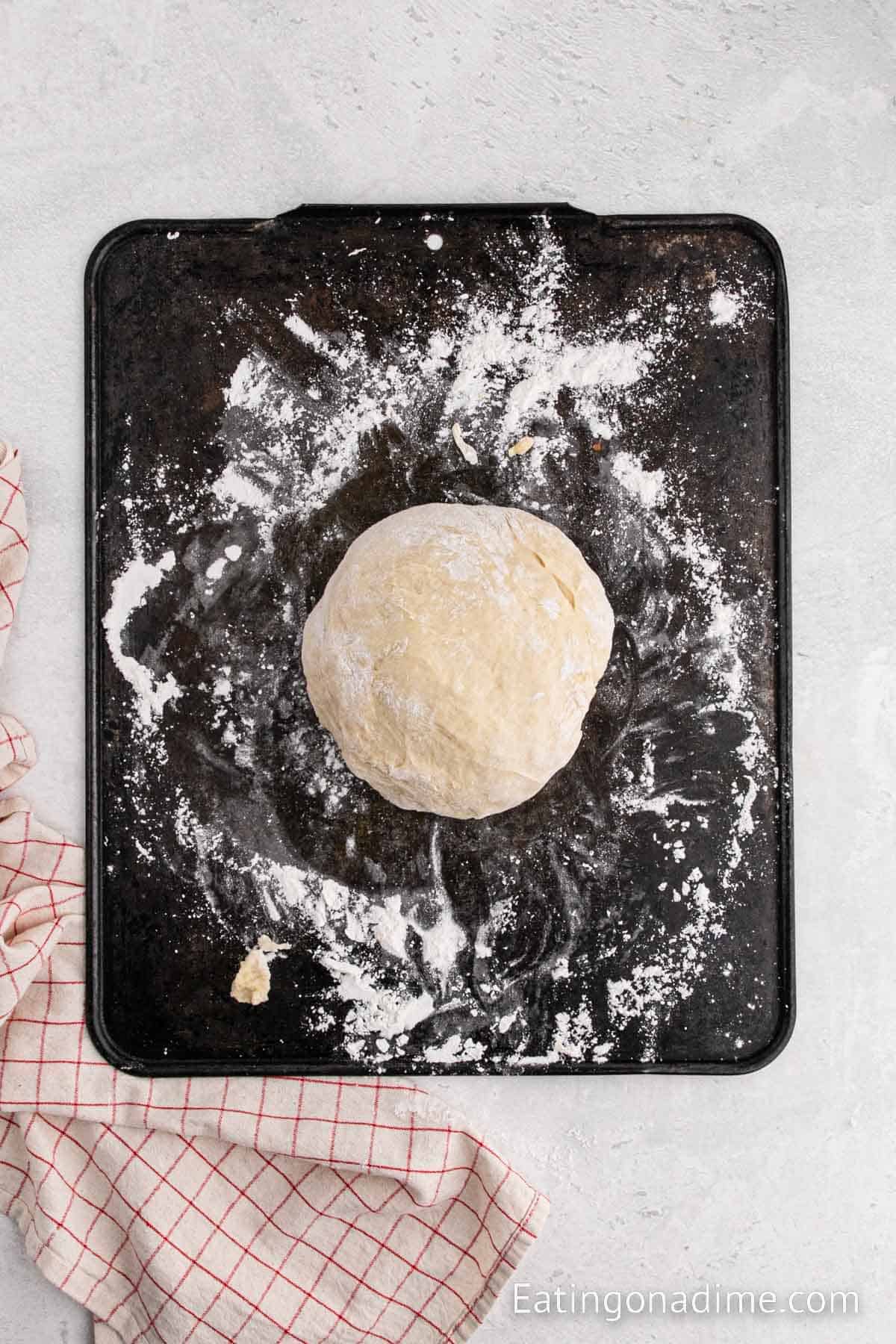Dough ball on a floured surface