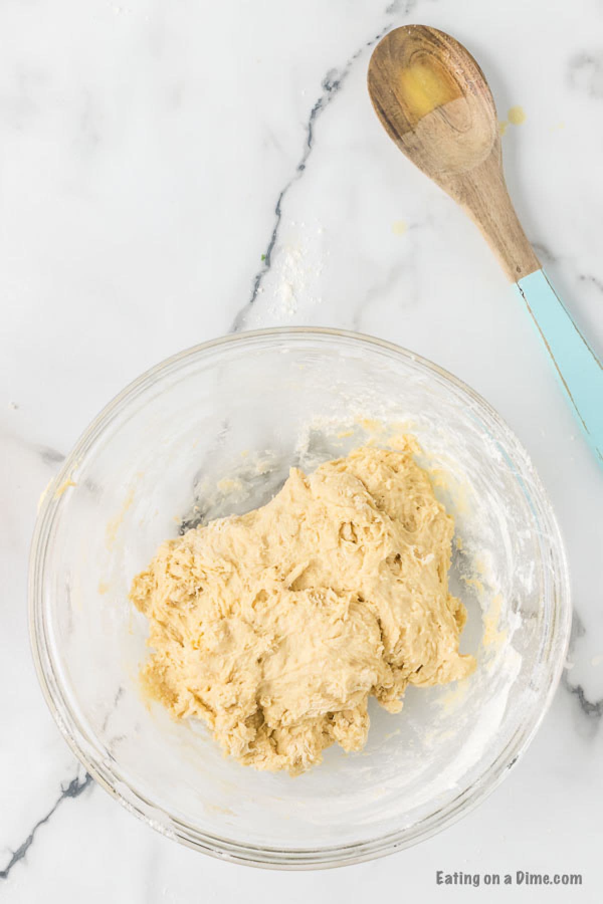 Add in flour to the yeast mixture to form into dough