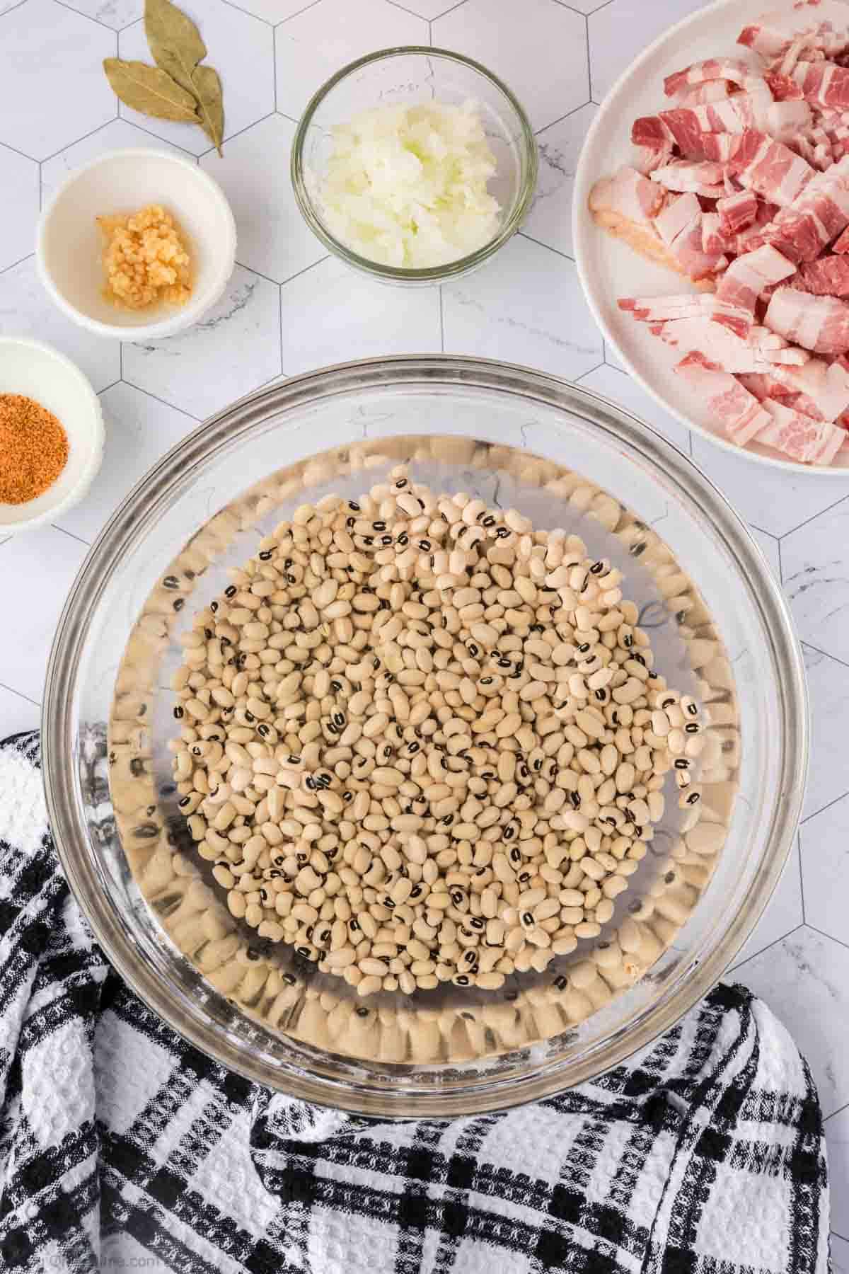 Soaking dry black eyed peas in a bowl