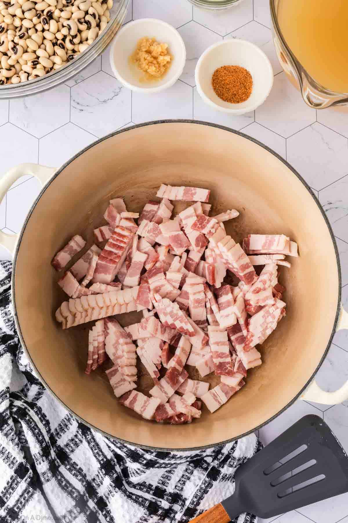 Cooking chopped bacon in the large pot